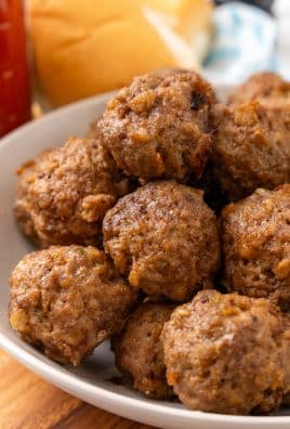 easy baked meatballs stacked in a white bowl