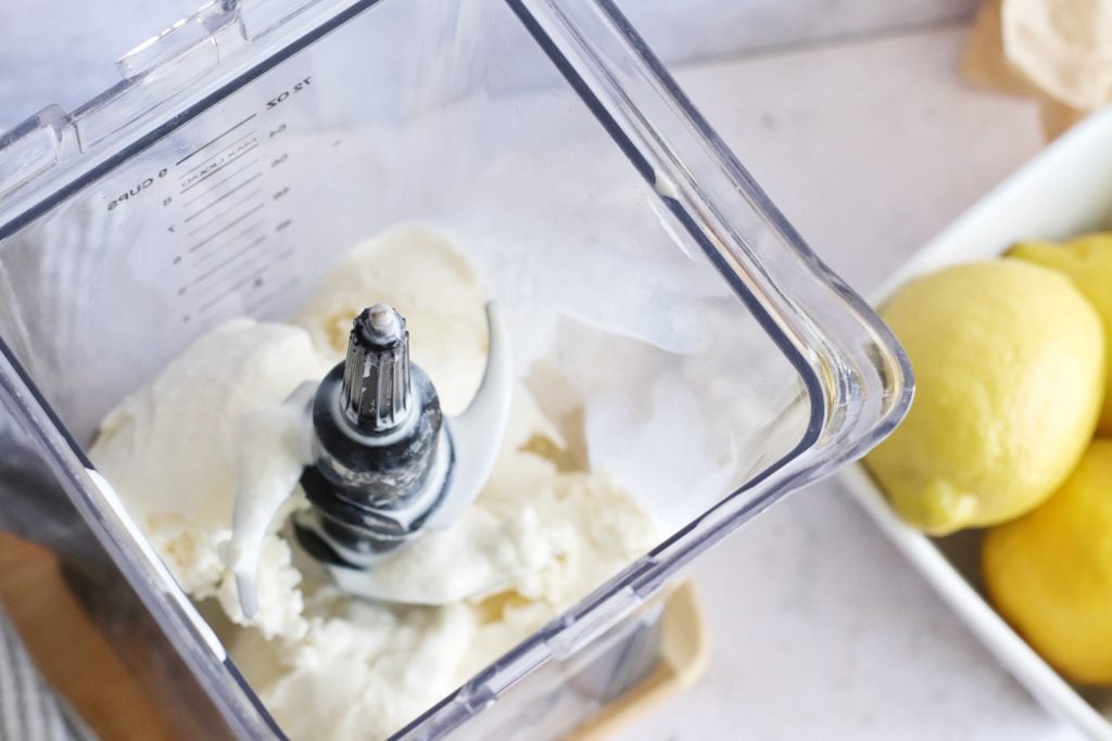 ingredients show being added to a high powered blender to make a copy cat chick fil a frosted lemonade
